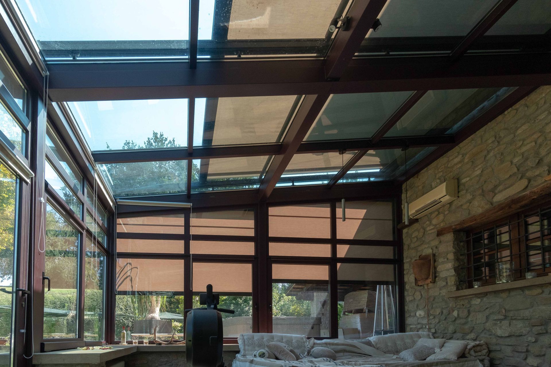 A living room with a lot of windows and a couch - Freehold, NJ - Awning Design Inc