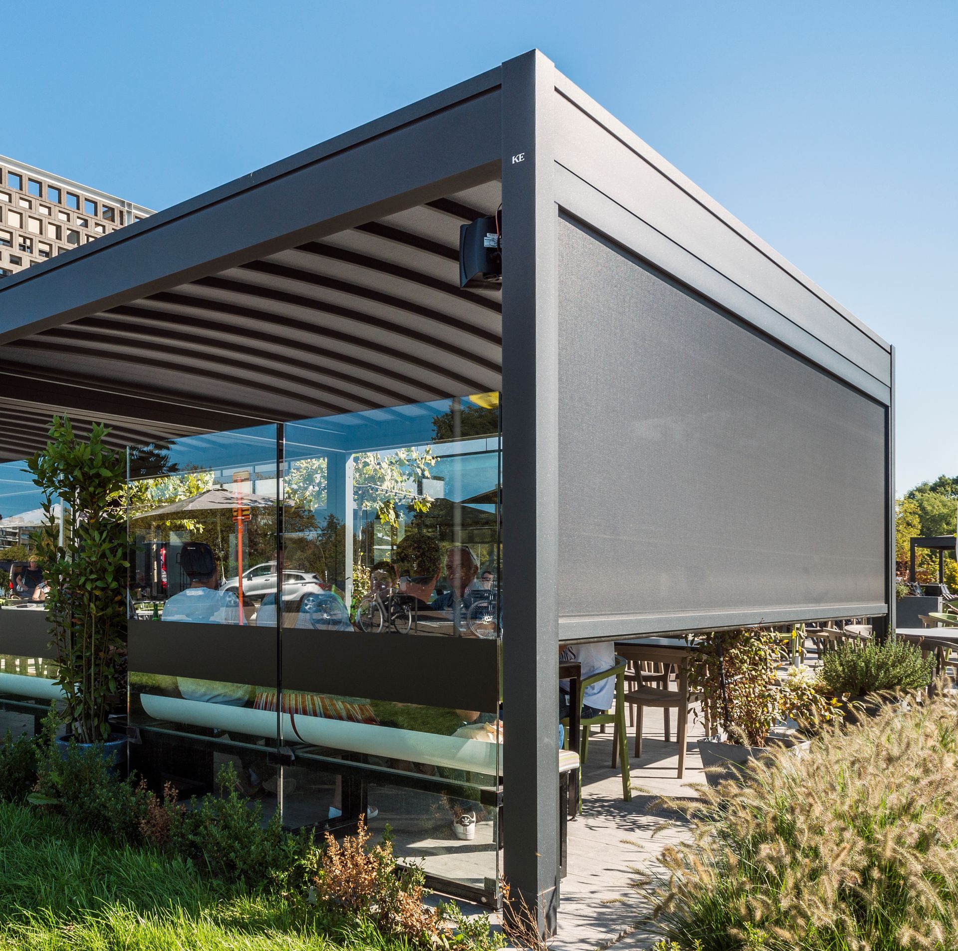 A restaurant with a large screen on the side of it - Freehold, NJ - Awning Design Inc