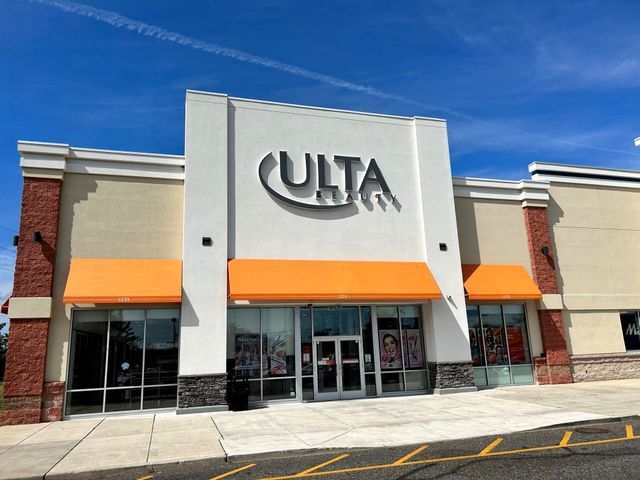 The front of a ulta store with orange awnings - Freehold, NJ - Awning Design Inc
