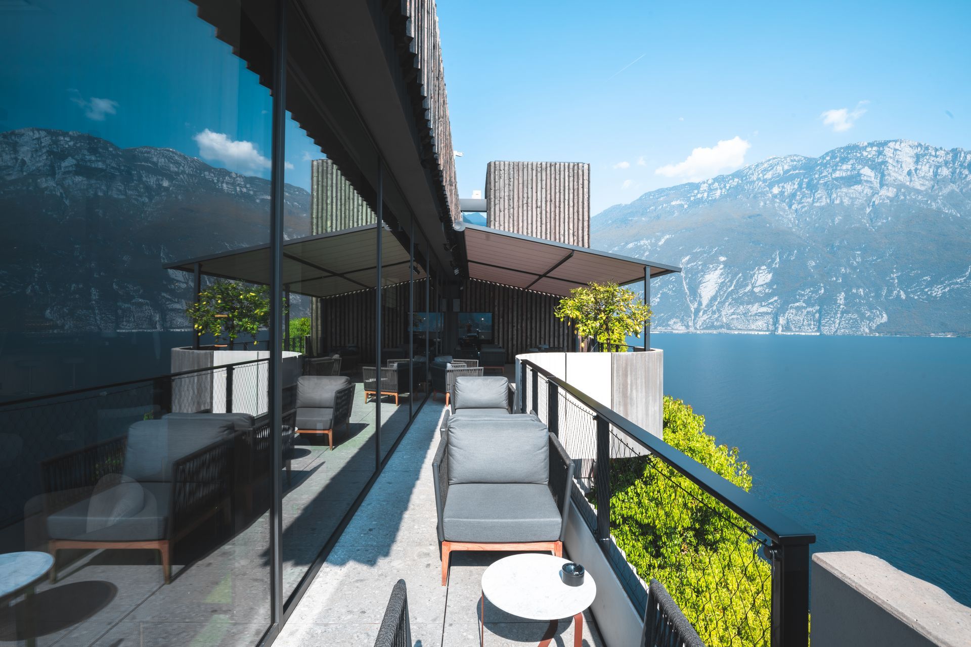 A balcony with a view of a lake and mountains - Freehold, NJ - Awning Design Inc