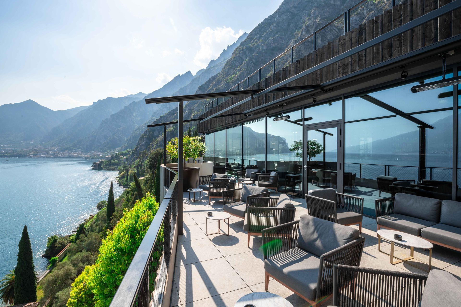 A balcony with a view of a lake and mountains - Freehold, NJ - Awning Design Inc