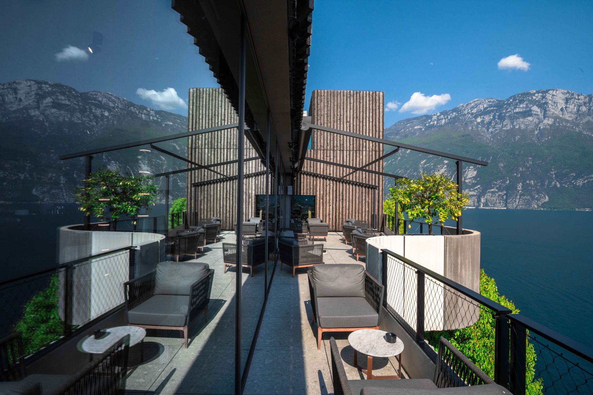 A balcony with a view of a lake and mountains - Freehold, NJ - Awning Design Inc