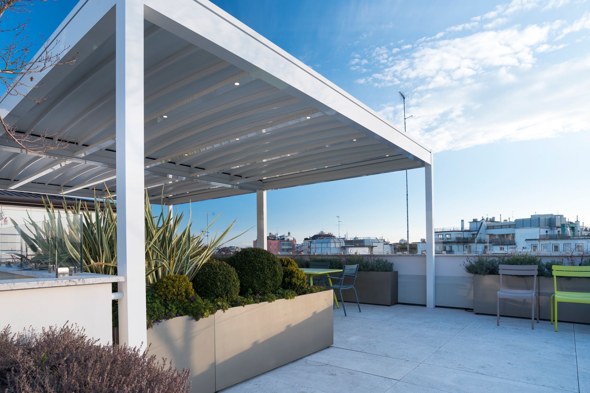 A rooftop with a pergola and planters on it - Freehold, NJ - Awning Design Inc