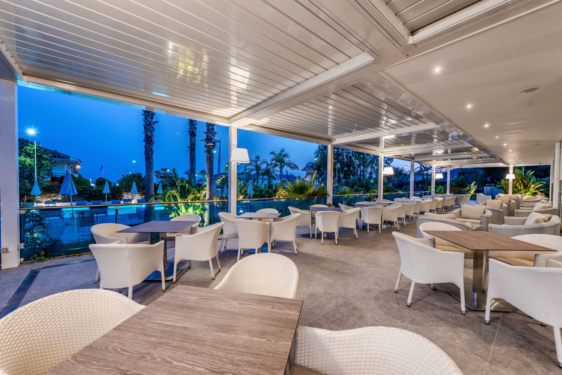 There are many tables and chairs in the restaurant - Freehold, NJ - Awning Design Inc