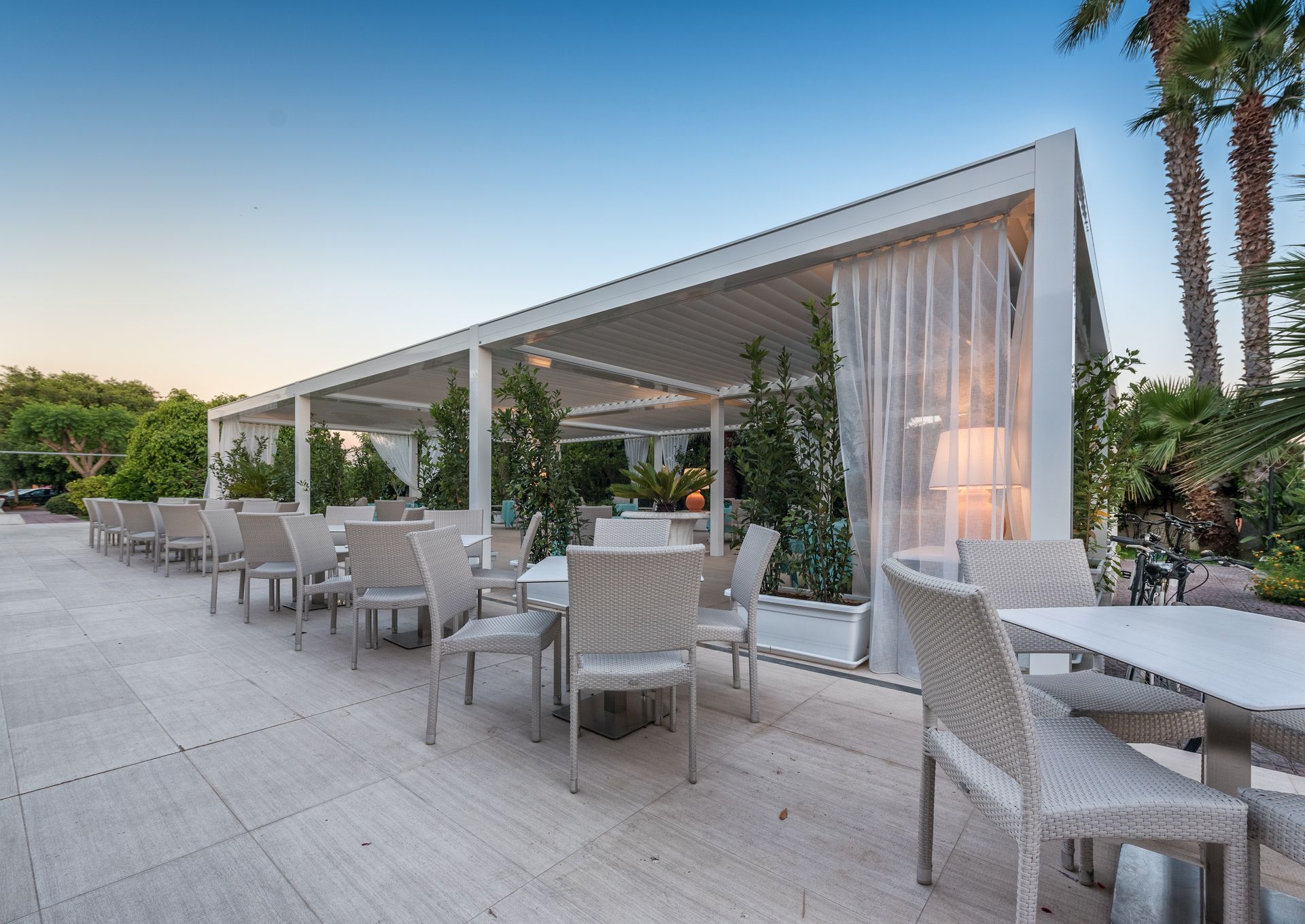 A restaurant with tables and chairs under a canopy - Freehold, NJ - Awning Design Inc