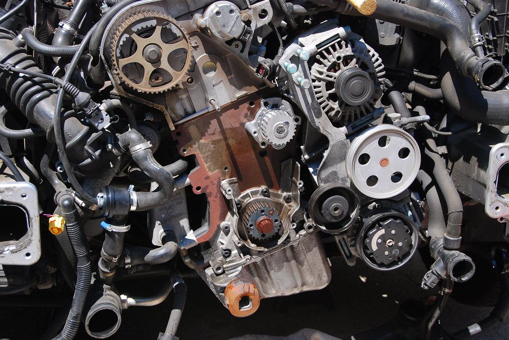 A close up of a car engine with a lot of parts