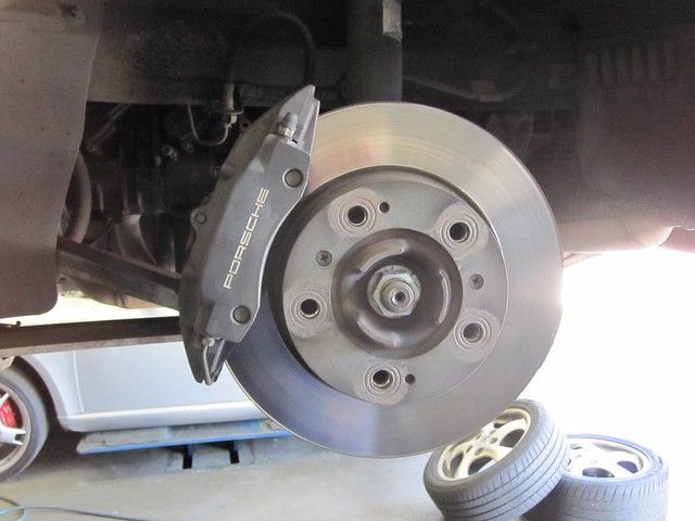 A close up of a brake disc on a car