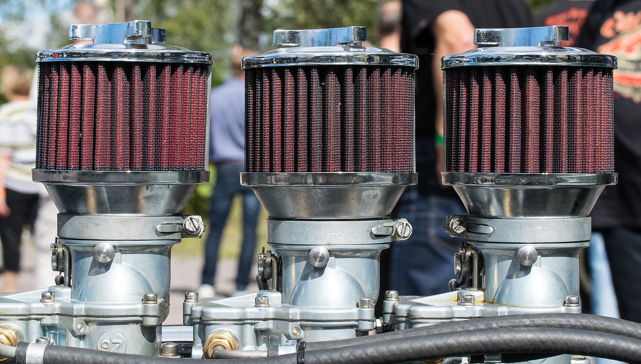 A close up of three air filters on a machine