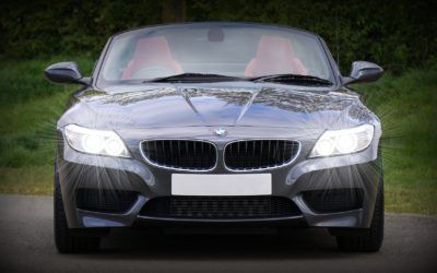A bmw z4 is parked on the side of a road.