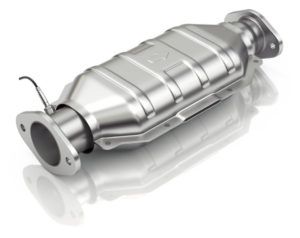 A stainless steel catalytic converter is sitting on a white surface.
