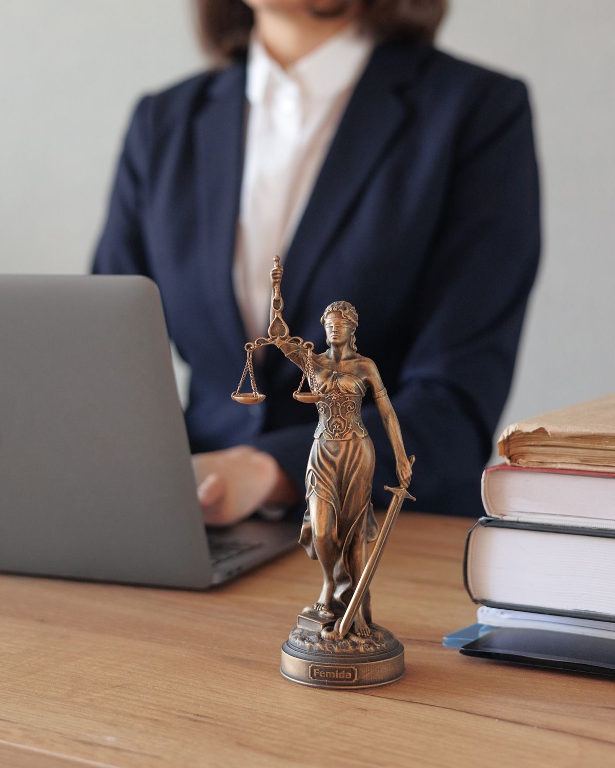 a female lawyer conducts an online consultation from a laptop