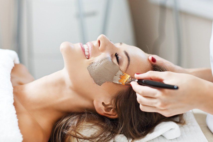 Picture of woman with facial mask in beauty salon