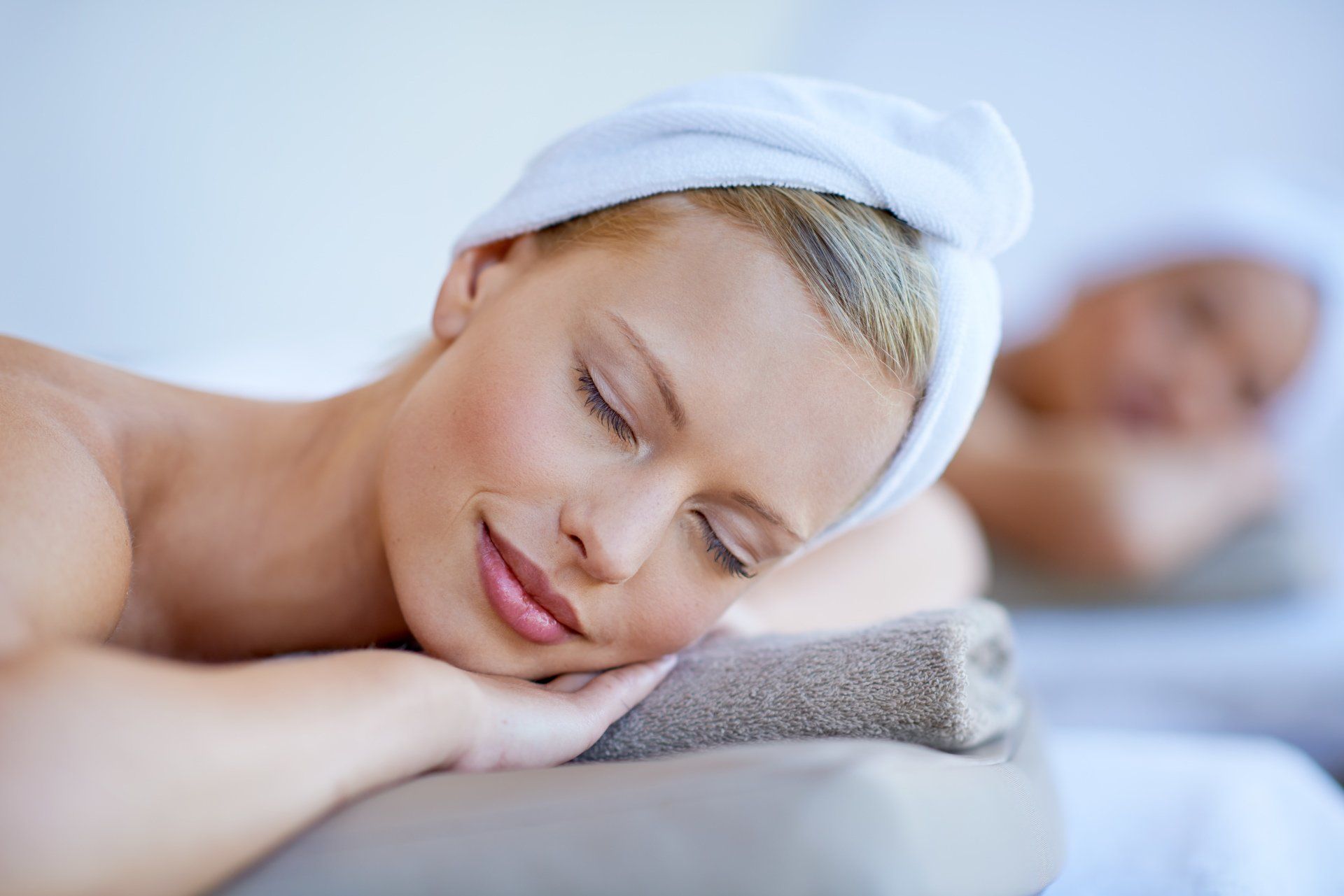 A young woman lying on a massage table