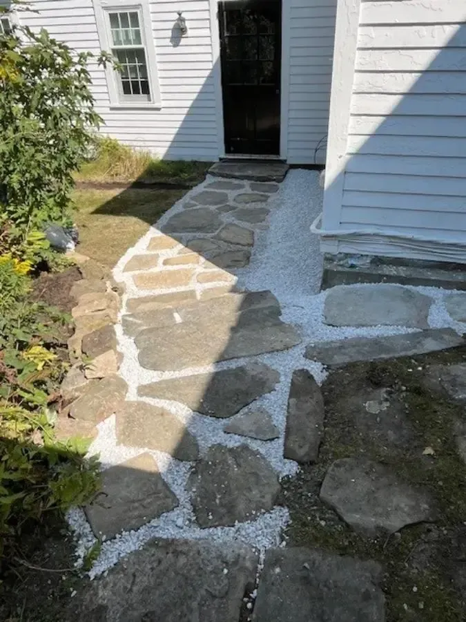 Installed drainage and leveled the walkway