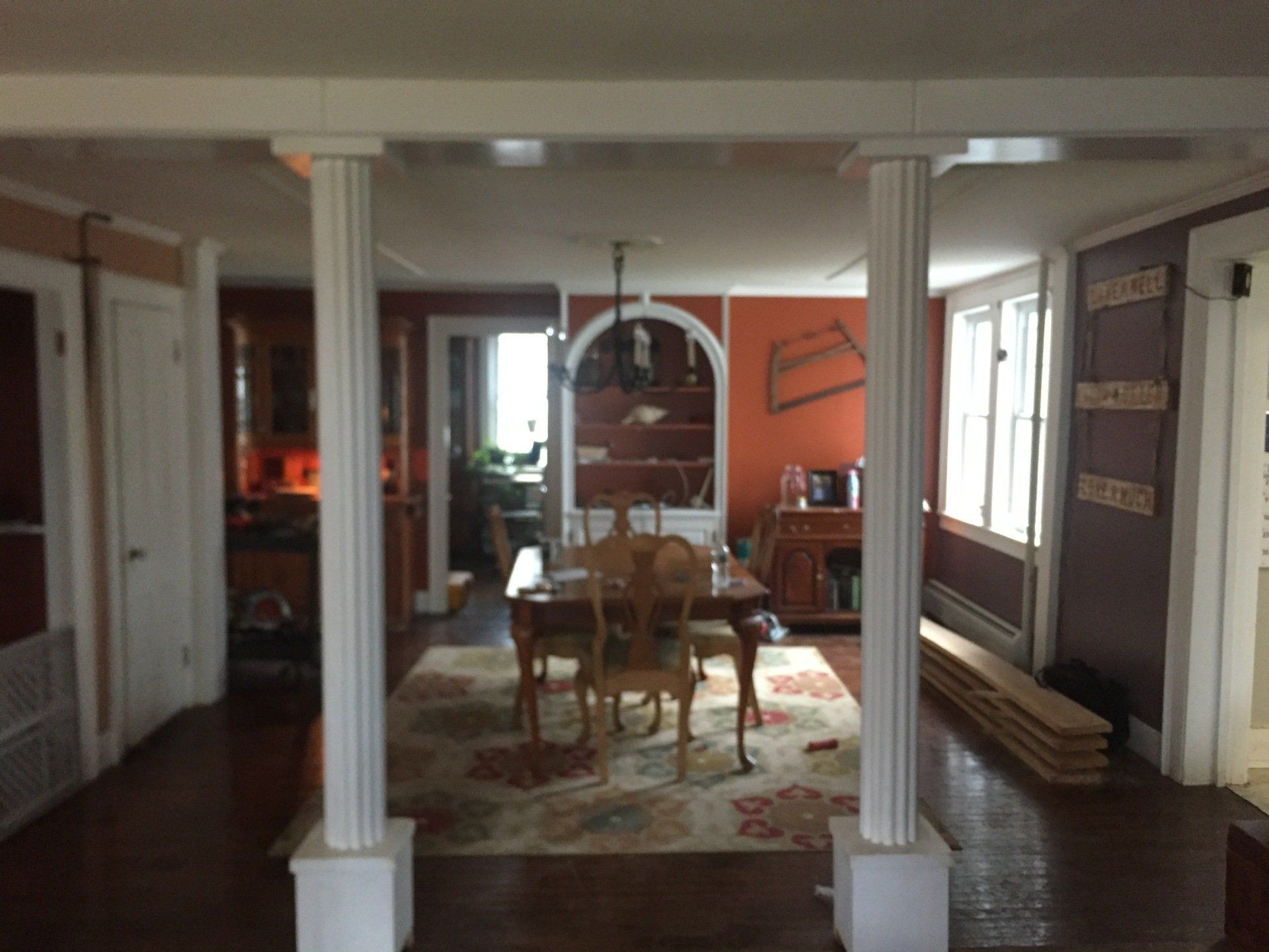 A dining room with a table and chairs in it