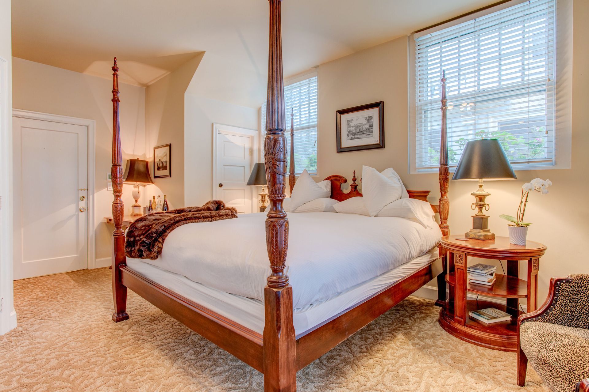 There is a four poster bed in the middle of the room.