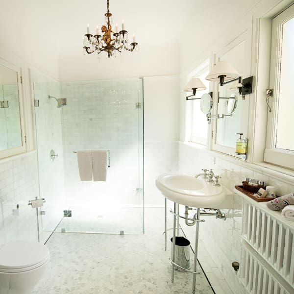 A bathroom with a toilet sink and shower