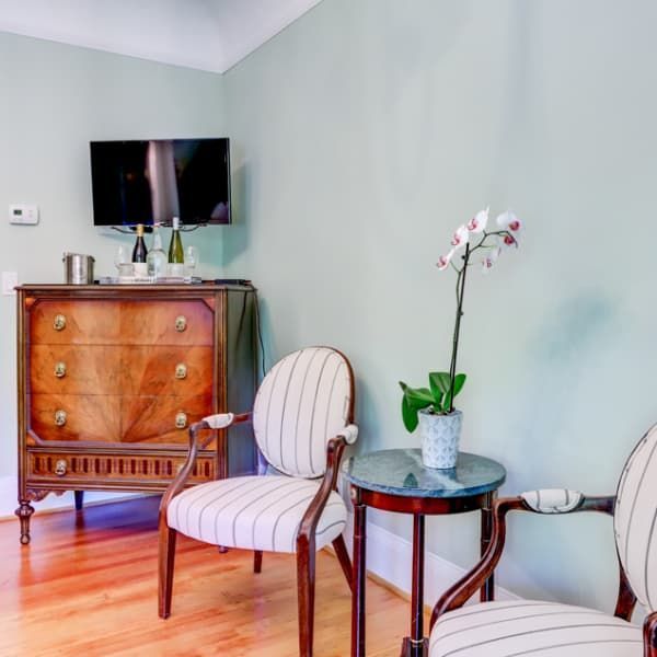 A living room with two chairs and a small table