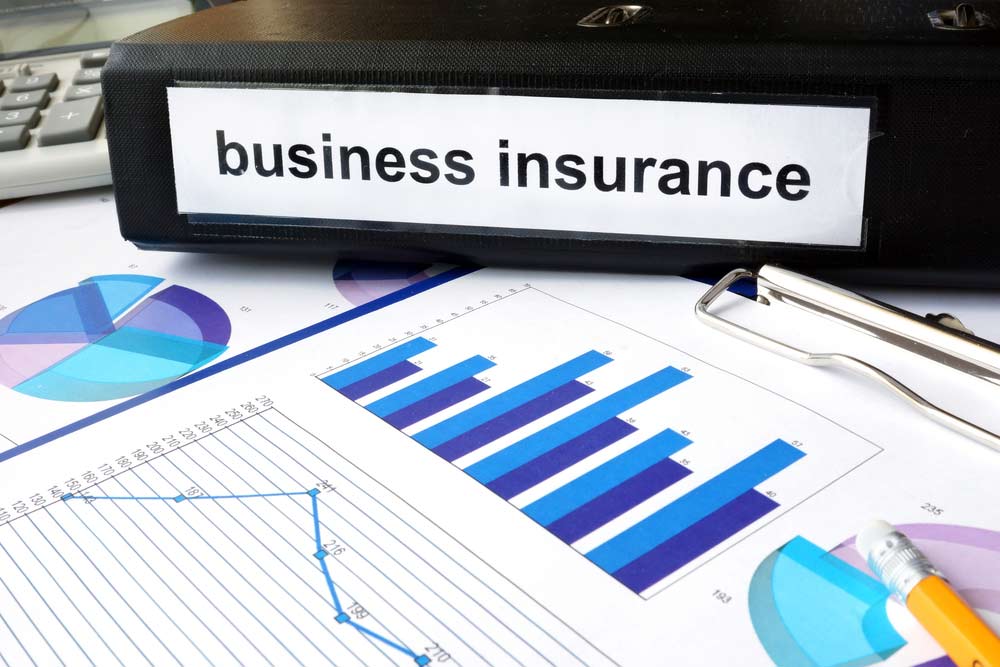 Folder with the label business insurance and charts — Insurance Services in Mackay QLD
