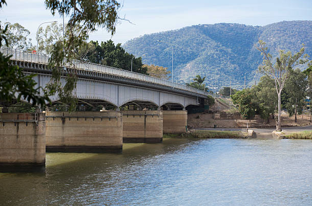 A bridge over a river with mountains in the background — Insurance in Rockhampton QLD