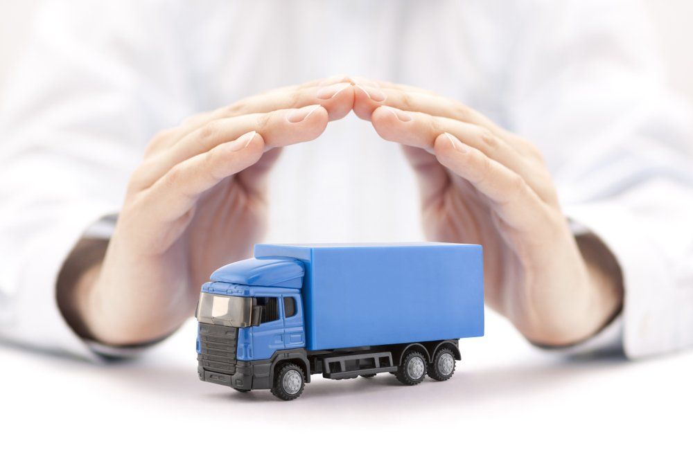 Hands Protecting Truck Model — Insurance Services in Rockhampton, QLD