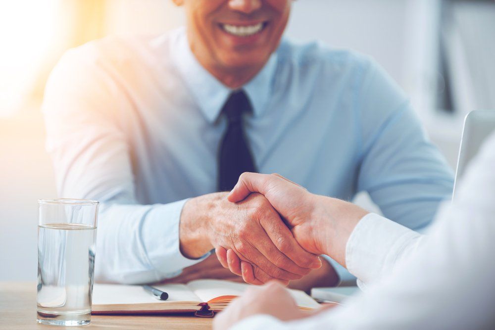 Men Shaking Hands — Insurance Services in Rockhampton, QLD