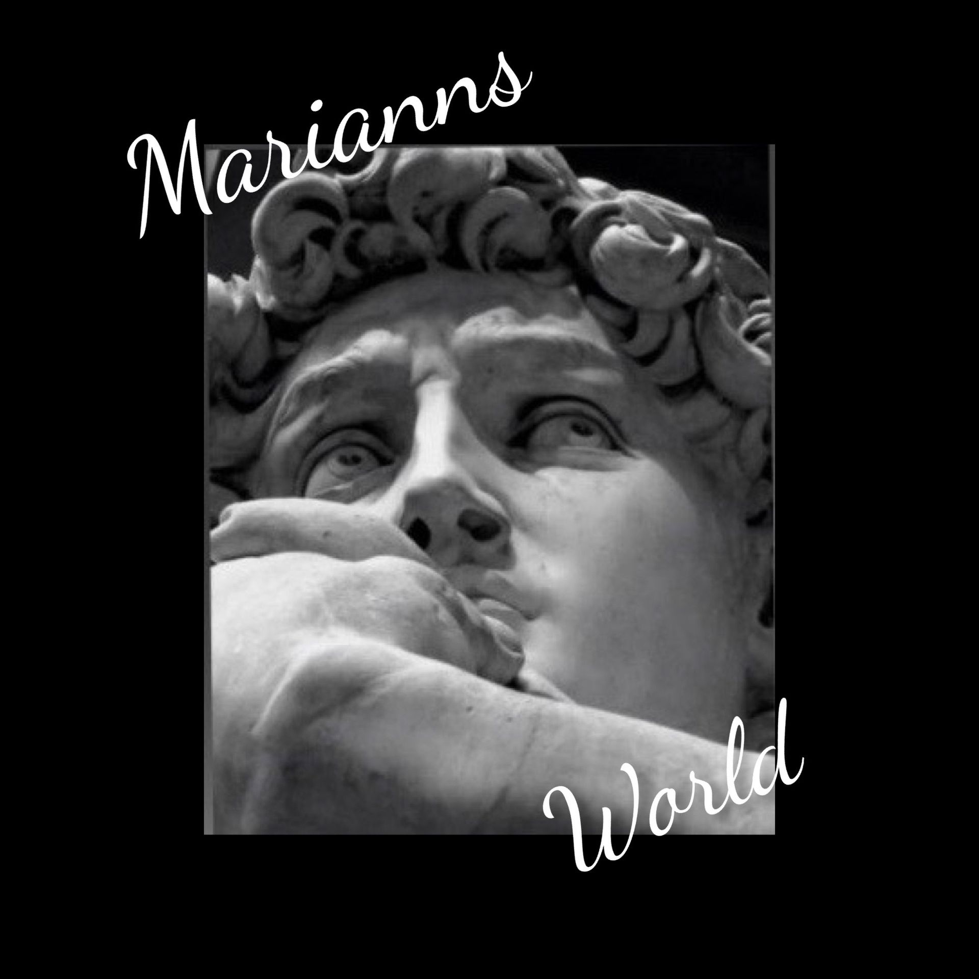 A black and white photo of a statue with the words marianns world below it