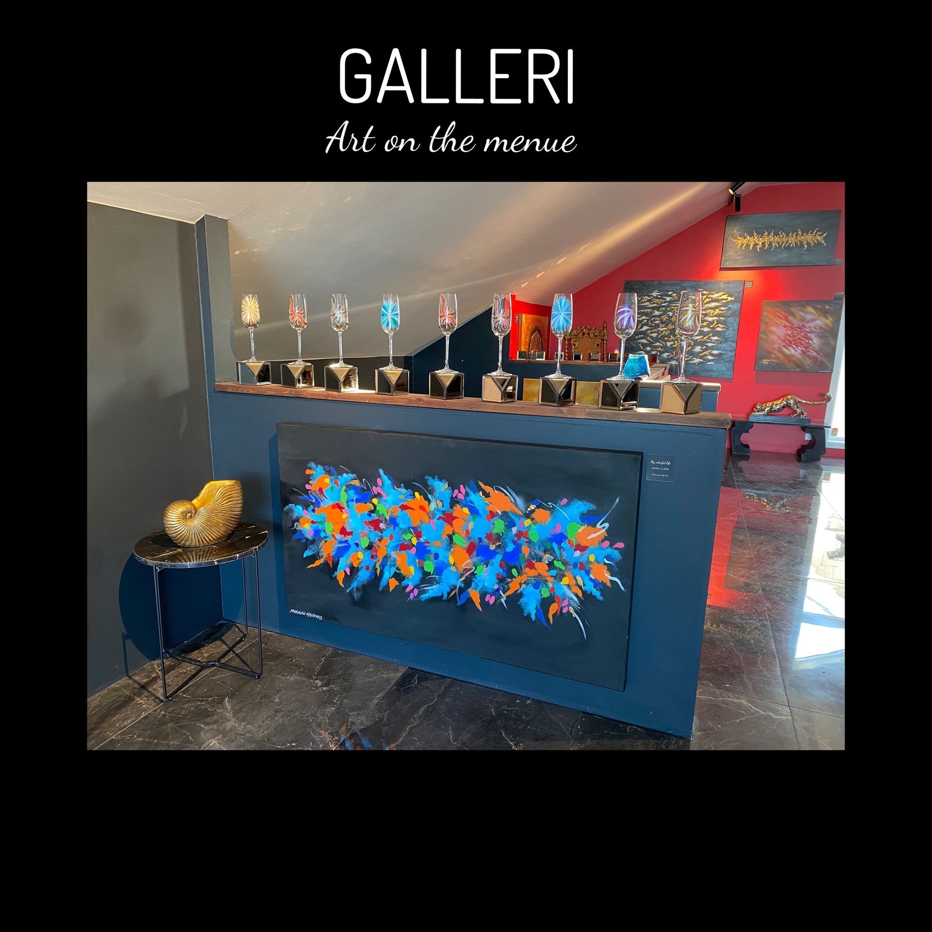 A colorful painting is hanging on a wall in a gallery.