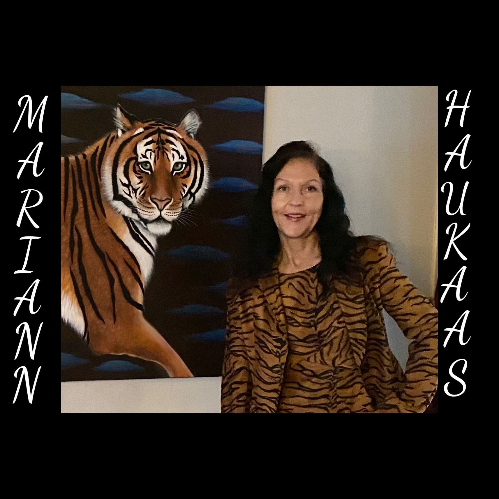 A woman is standing in front of a painting of a tiger.