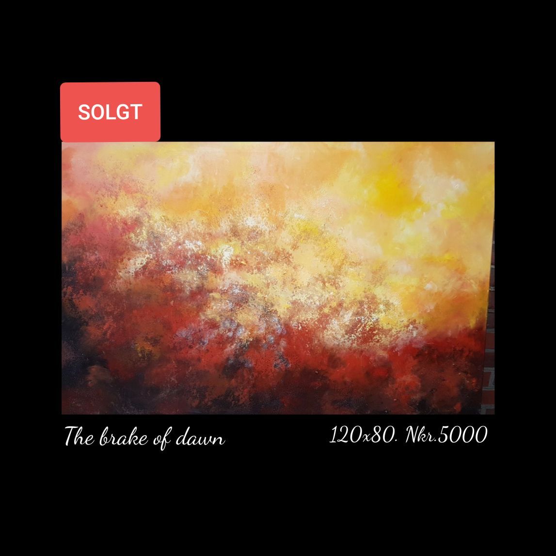 A painting of a sunset with a sold tag on it.