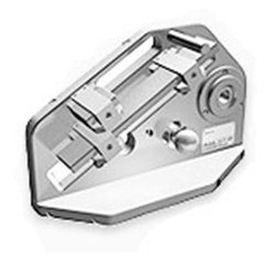 A close up of a metal object on a white surface.