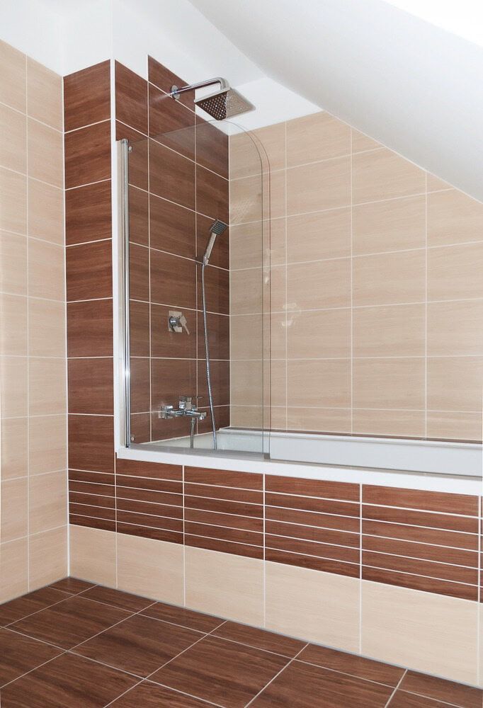 A Bathroom with A Bathtub and A Glass Shower Door — Colour Splash in Merewether, NSW