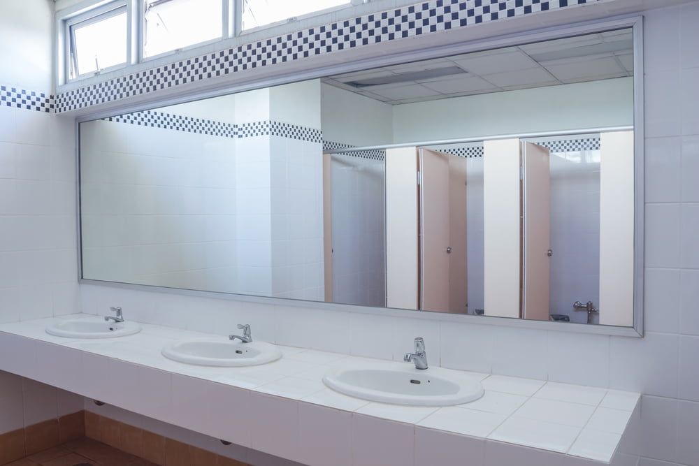A Bathroom with Three Sinks and A Large Mirror — Colour Splash in Central Coast, NSW