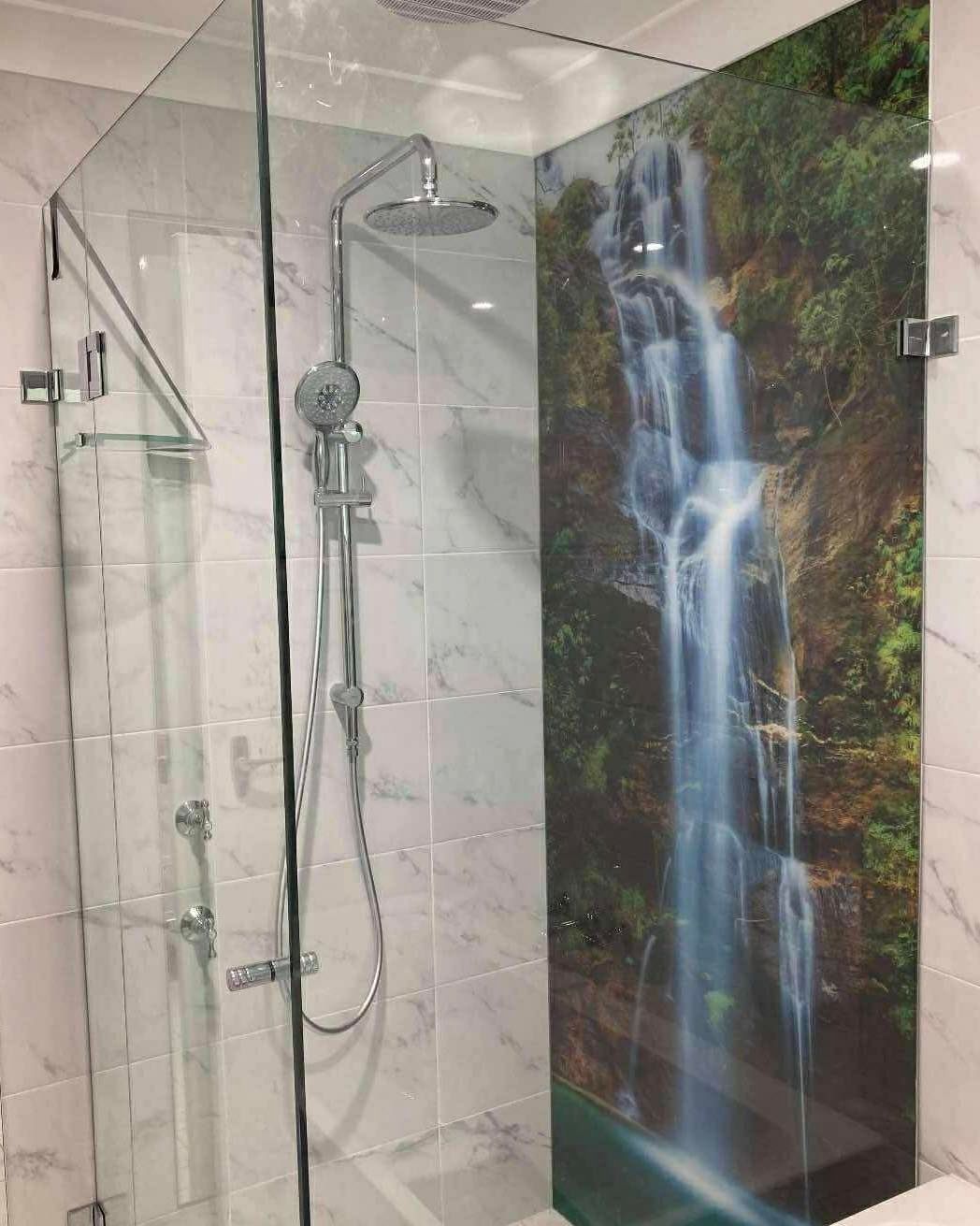 Shower Enclosure With Glass Walls And A Waterfall Mural