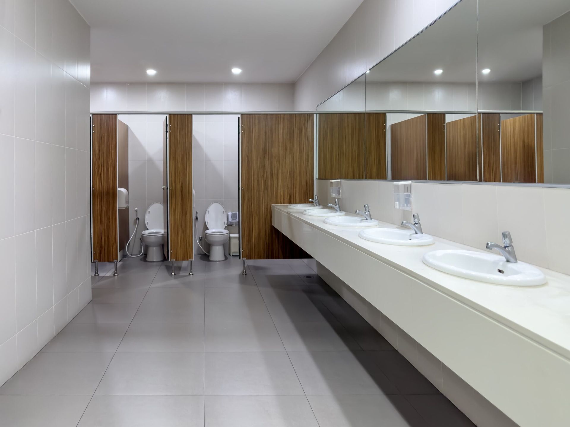 A Public Restroom with Toilets and Sinks and A Large Mirror — Colour Splash in Port Stephens, NSW