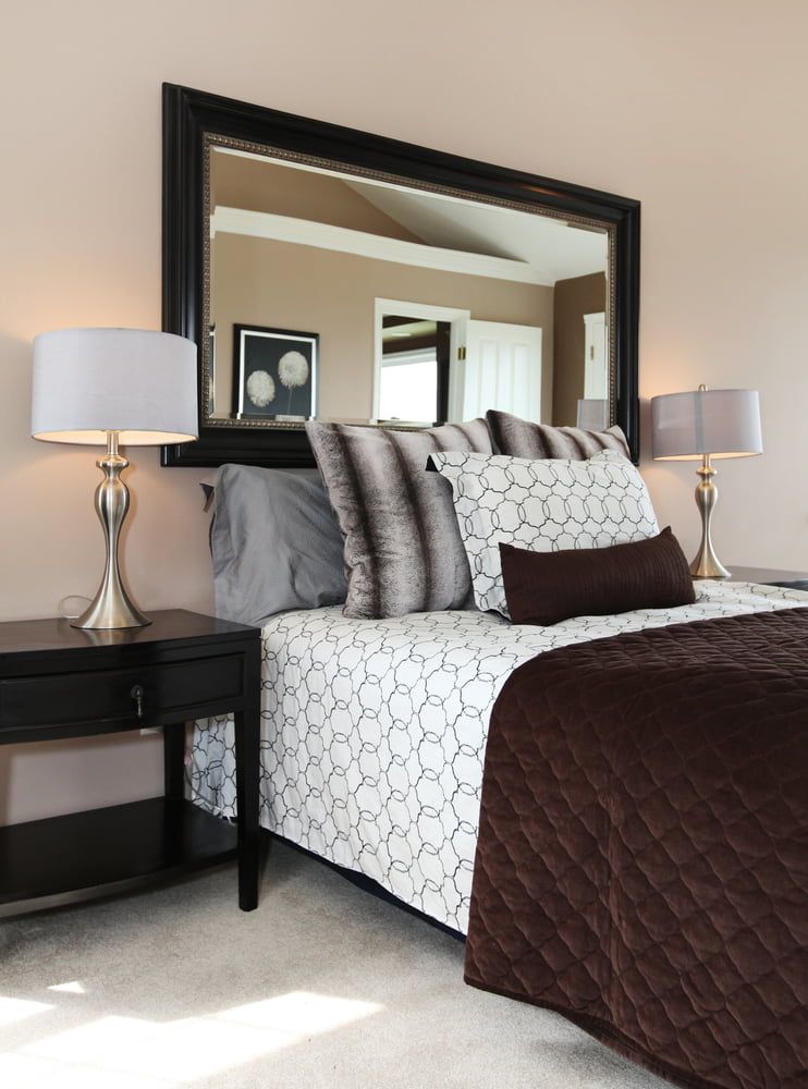A Bedroom with A Large Mirror Above the Bed — Colour Splash in Lake Macquarie, NSW
