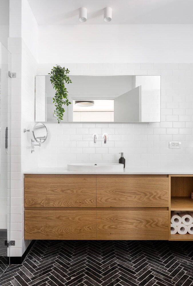 A Bathroom with A Sink, Mirror and Wooden Cabinets — Colour Splash in Maitland, NSW