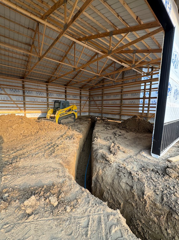 Two excavators are working on a construction site.