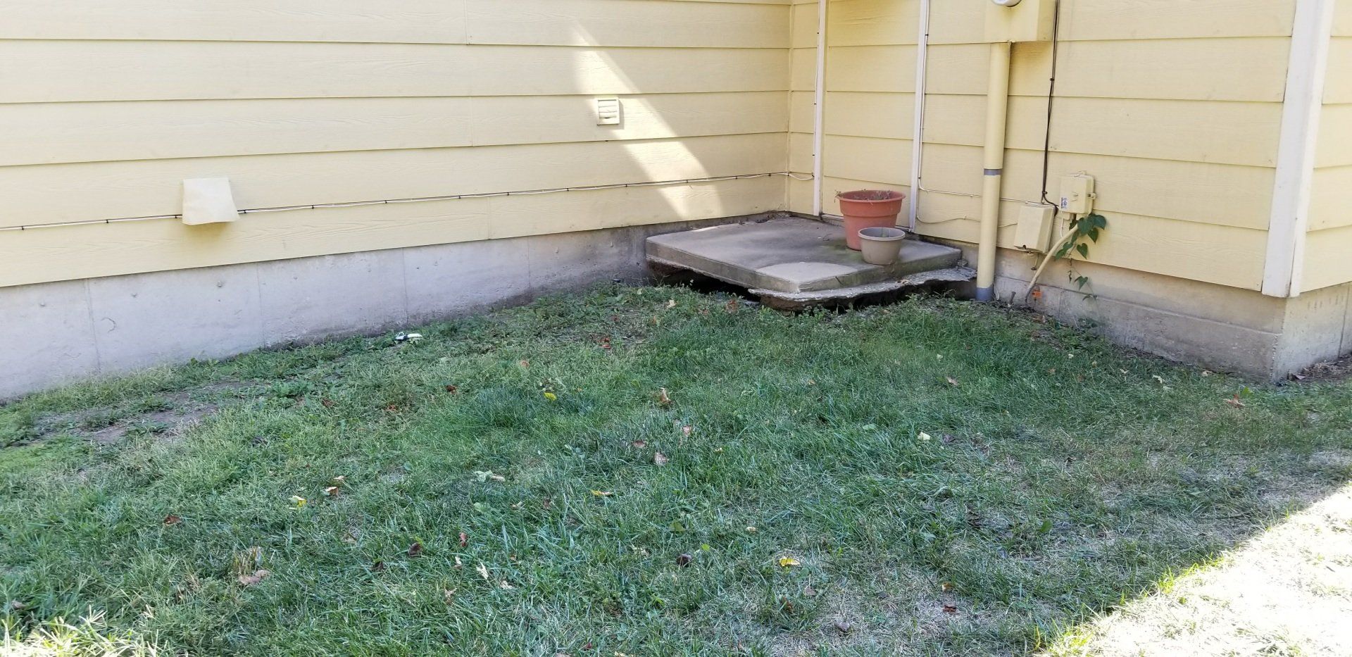 Stone — Grassy Corner Of A House in Wichita, KS