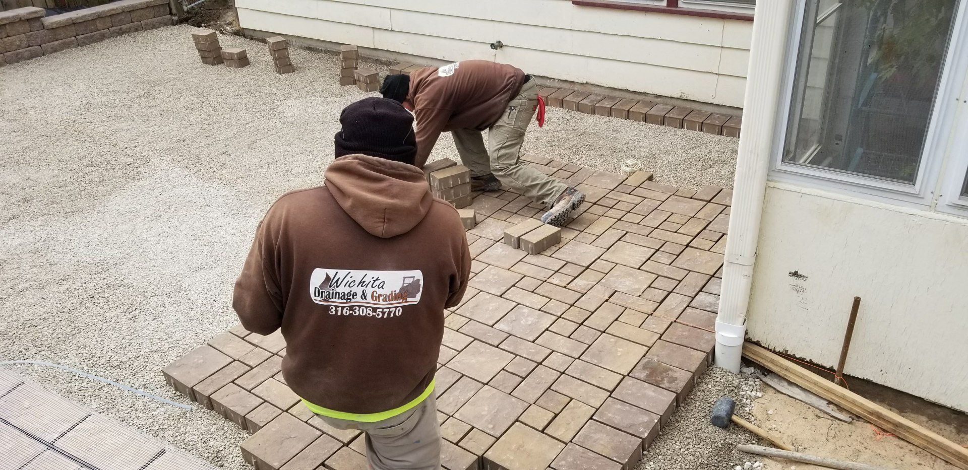 Contractor — Man Installing Brick Floor in Wichita, KS