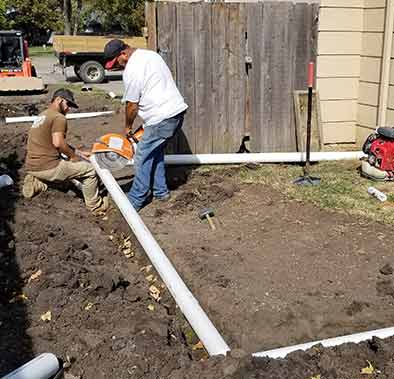 Workers Installing Drainage System — Improve Drainage in Wichita, Kansas
