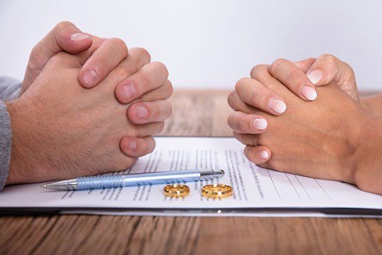 Couple's Hand with Divorce Agreement — Sand Pedro, CA — Delta Bravo Group