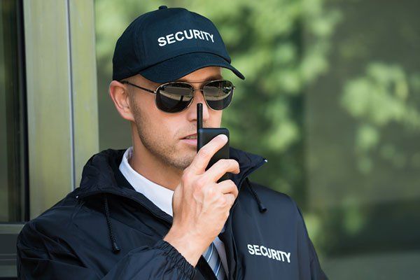 Security Guard Talking on Walkie-Talkie — Sand Pedro, CA — Delta Bravo Group