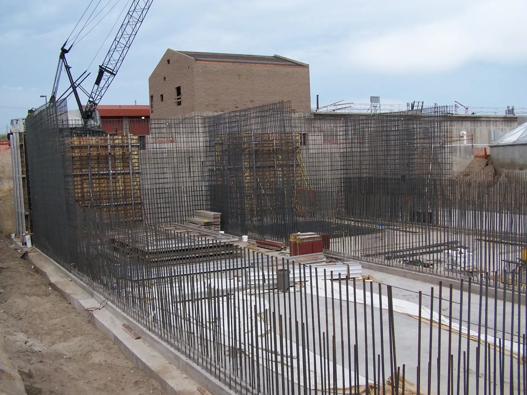 Construction site with concrete forms for foundation footings.