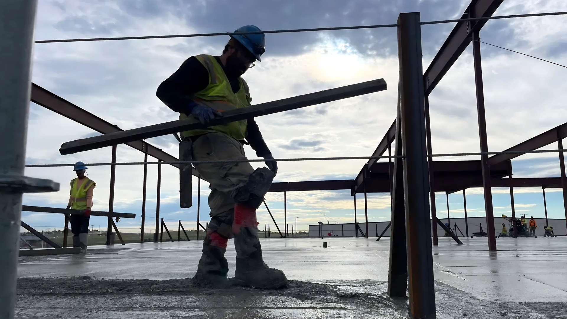 Commercial concrete slab installation at a Colorado Springs jobsite with forms, reinforcement