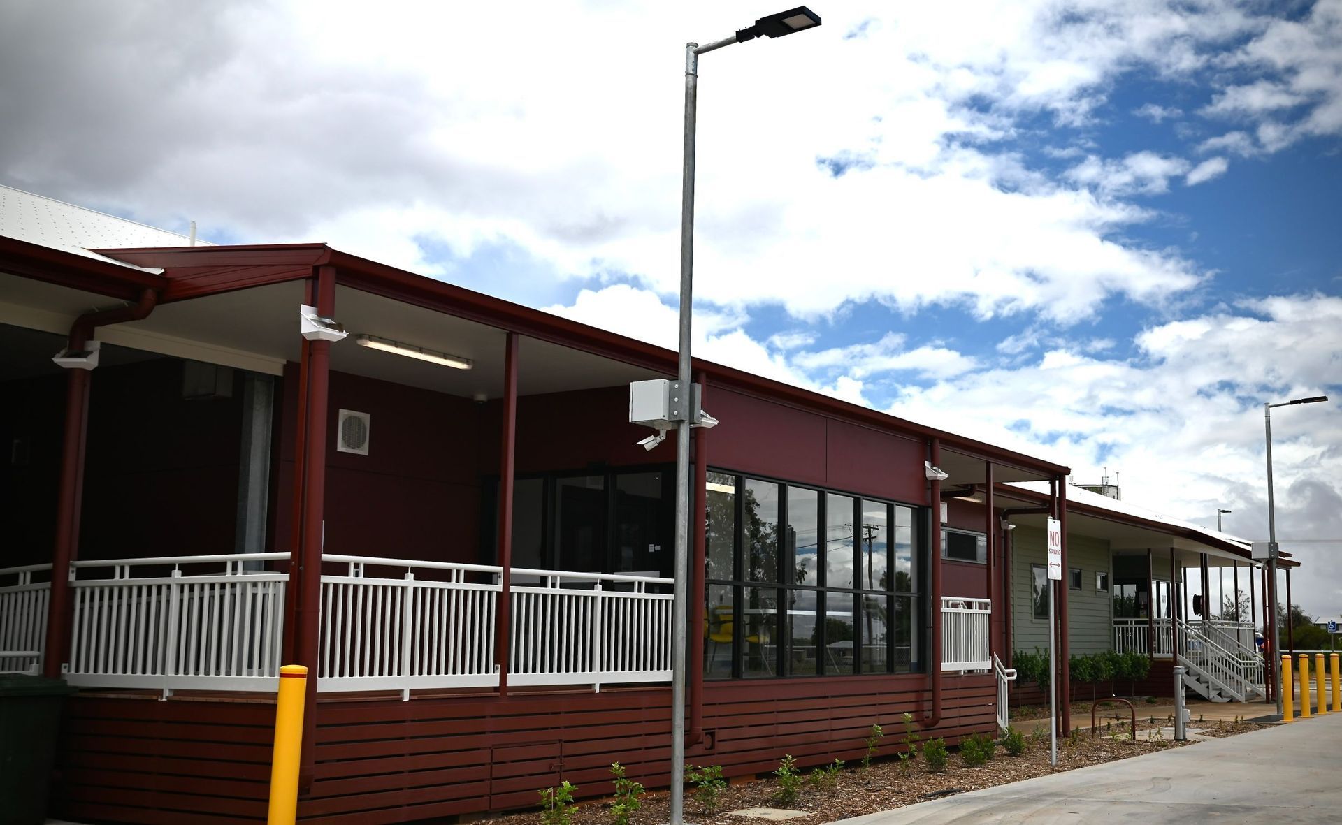 A Building With A Porch And A Street Light In Front Of It — Custom Steel Fab in Garbutt, QLD