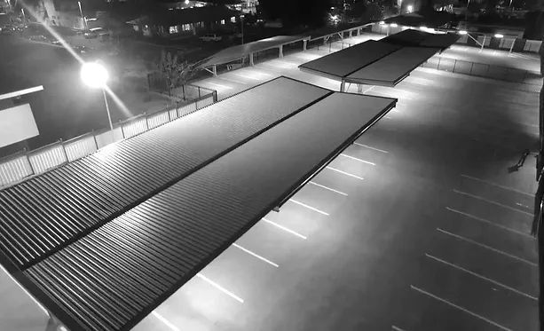 A Black and White Photo of A Parking Lot at Night — Complete Fabrication in Townsville