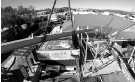 A Black and White Photo of A Crane Lifting a Building — Complete Fabrication in Townsville