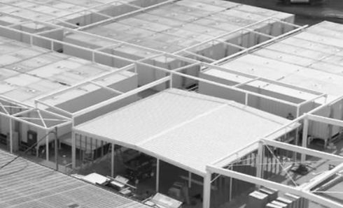 A Black and White Photo of A Building Under Construction — Complete Fabrication in Townsville