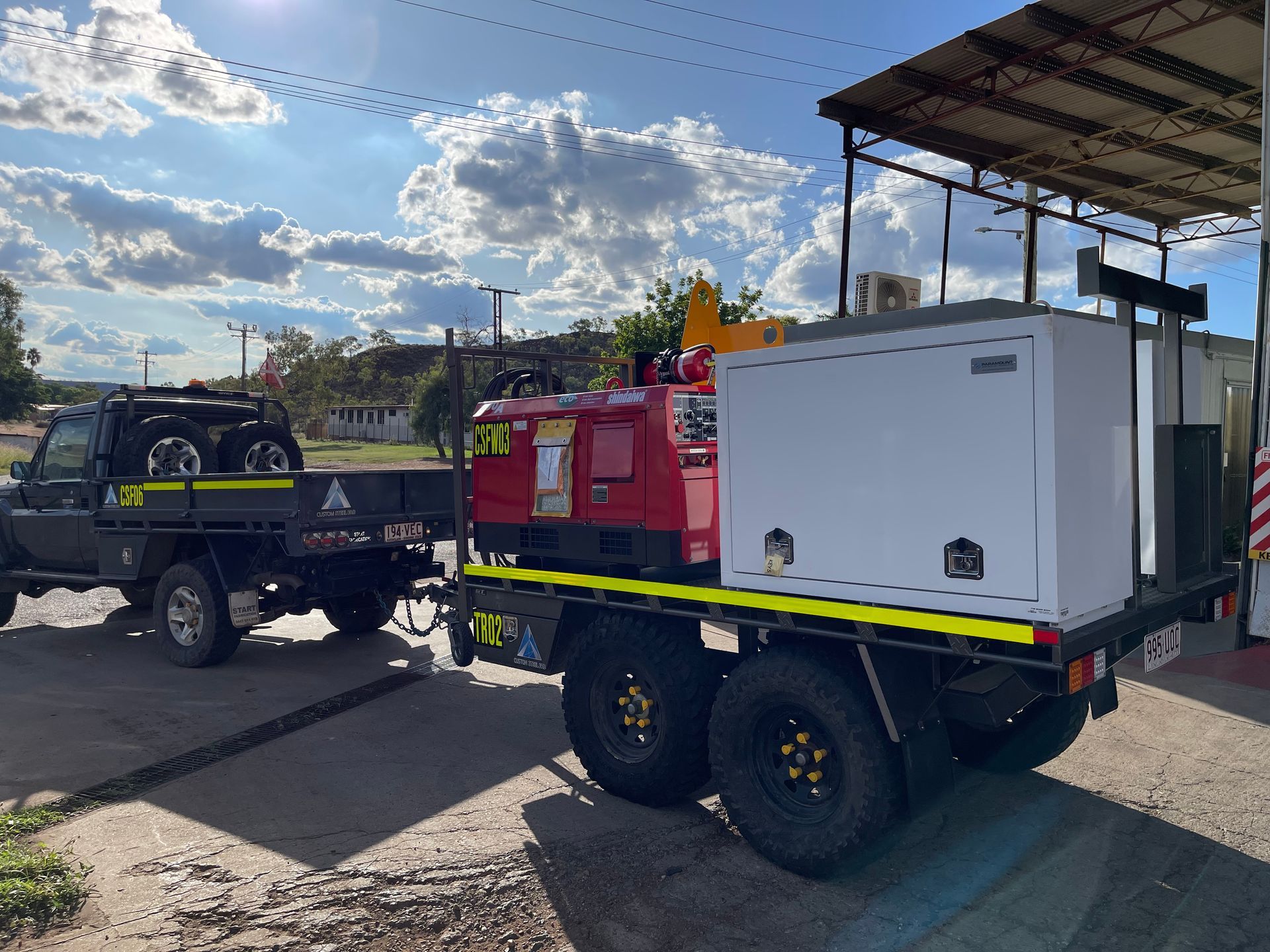 A Truck With A Trailer Attached To It Is Parked On The Side Of The Road — Custom Steel Fab in Garbutt, QLD